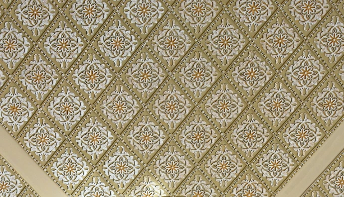 Intricate geometric pattern on a textured ceiling